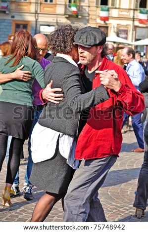 TURIN, ITALY - APRIL 16: Couple of unidentified Argentine tango dancers in the streets of Turin during the International 