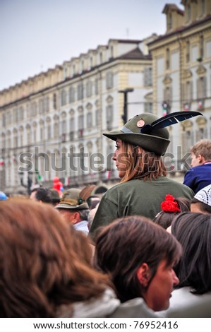 TURIN, ITALY - MAY 6: An unidentified woman wears a typical militar hat of veterans Alpini during the 84th National Gathering of Alpini (italian mountain troops) on May 6, 2011 in Turin, Italy.