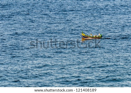 Luzzu (a traditional fishing boat from the Maltese islands) on Qbajjar Bay, Gozo