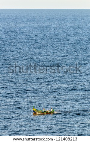 Luzzu (a traditional fishing boat from the Maltese islands) on Qbajjar Bay, Gozo