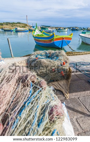 Traditional Kajjik Boat at Marsaxlokk harbor, a fishing village located in the south-eastern part of Malta.