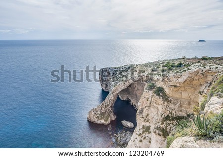 Blue Grotto (Taht il-Hnejja) cavern on the southern coast of Malta, near the village of Zurrieq and the small uninhabited islet of Filfla.