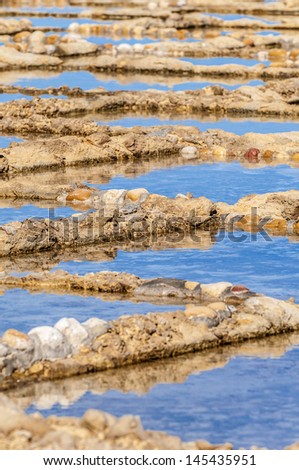 Salt evaporation ponds, also called salterns or salt pans located near Qbajjar on the maltese Island of Gozo.