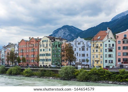 INNSBRUCK, AUSTRIA - AUG 14: Inn river, a 517 kilometres long tributary of the Danube on its way through the capital of Tyrol region on Aug 14, 2013 in Innsbruck, Austria.