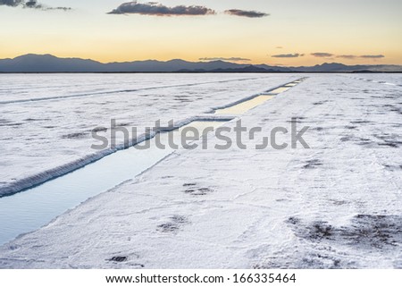Sunset in Salinas Grandes salt flats water pool in Jujuy province, northern Argentina.