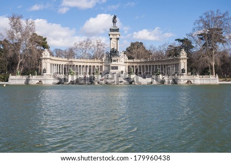 MADRID, ES - JANUARY 24, 2013: People enjoying the Great Pond (Estanque del Retiro), which served as the setting for mock naval battles and other aquatic displays on Buen Retiro Park.