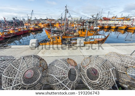 MAR DEL PLATA, ARGENTINA - APR 04: Typical orange fishing boats on the port of the coastal city on Apr 04, 2013 in Mar del Plata, Argentina.