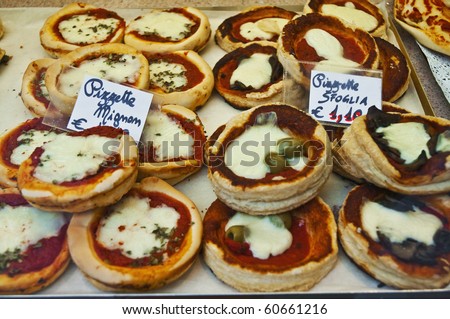 Local small pizzas with green and black olives called Mignom and Sfoglia