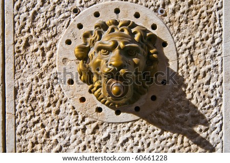 Detailed typical venetian bronze door bell as seen in many doors at Venice, Italy