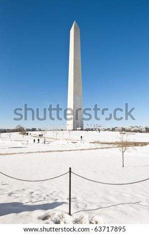 The Washington Monument after a snow blizzard at the Mall in DC, USA