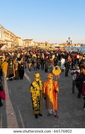 VENICE, IT - FEBRUARY 14: Unidentified disguised couple posing at the Carnival of Venice February 14, 2009 in Venice, IT.