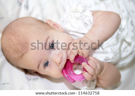 Help with teething. Teething toy in baby mouth