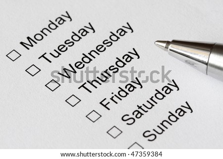 The days of week with checkboxes and pen to mark