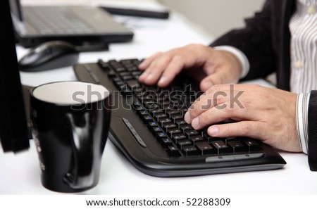 Men Office Desk. Typing on a Black Computer Keyboard.