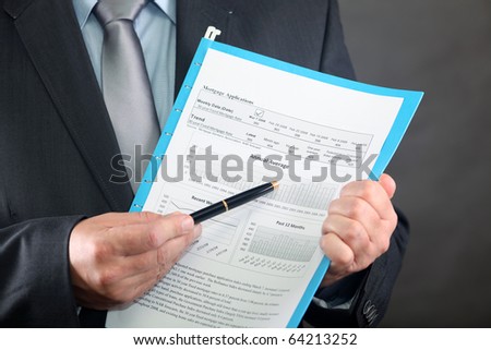 Mortgage Application Form in adviser hand