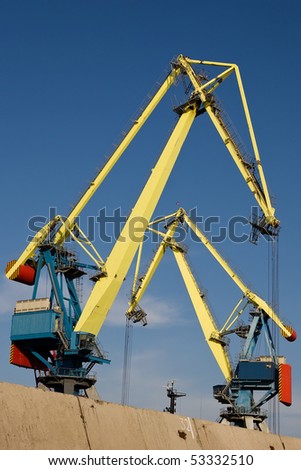 Huge industrial cranes working at the commercial dock