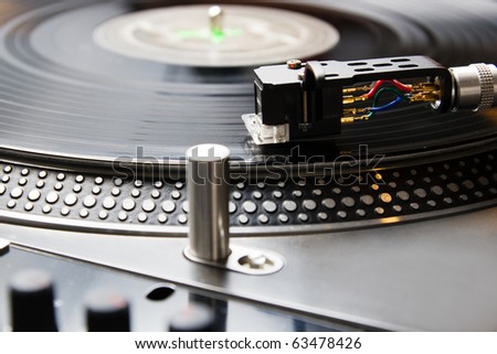 Close shot of analog audio equipment, useful for a professional DJ