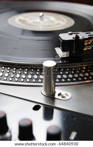 Close shot of analog audio equipment, useful for a professional DJ