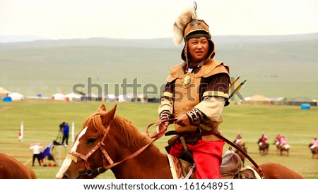 ULAANBAATAR, MONGOLIA - JULY 2013: Naadam Festival Horse Archery Crew with horse and traditional medieval outfit, posing