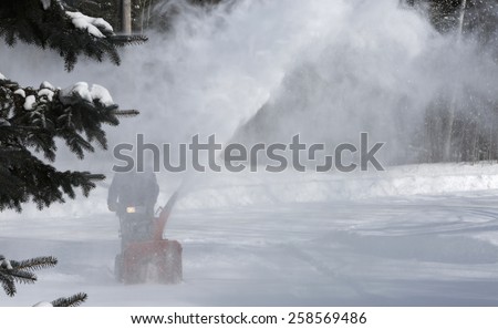 Winter blizzard: Clearing Snow with a Snow Blower