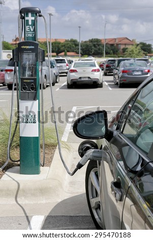 Austin, Texas,  July 10, 2015 Whole Foods electric vehicle charging station.\
Whole Foods Market is an American foods supermarket chain specializing in organic food, headquartered in Austin, Texas