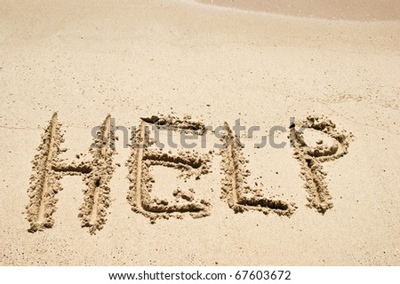 Help Sign on the beach