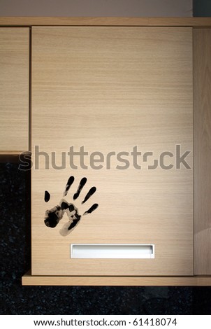 dirty hand print on food cupboard door