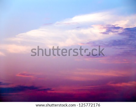 Colorful Cloudy Sky with the Sun Low on the Horizon