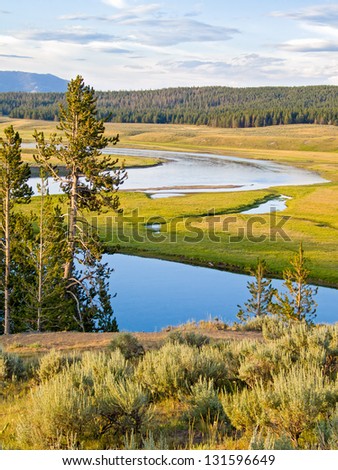 The Yellowstone River flows through he Heyden Valley before going over the Falls of the Yellowstone.