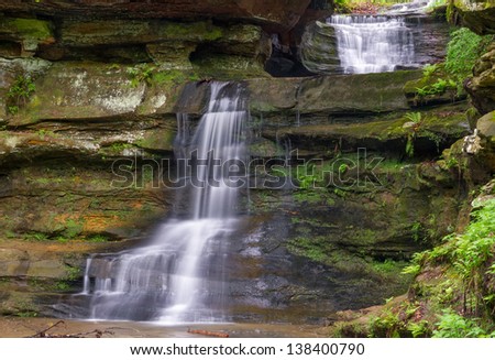 A waterfall with two plunges is found near the middle entrance to the gorge at Old Man\'s Cave in Ohio\'s Hocking Hills State Park.