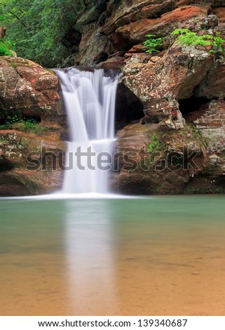 The beautiful Upper Falls, a waterfall at Old Man\'s Cave in Ohio\'s Hocking Hills State Park flows with spring rains.