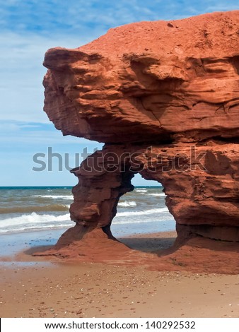 A red sandstone arch eroded by the sea along Prince Edward Island\'s Seaview Coast, Canada. Note: It  is reported that this arch has been claimed by the sea.