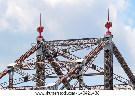 Two ornate red finials grace the top of this aged cantilever bridge spanning the Ohio River near Wheeling, West Virginia. Sadly, this bridge is scheduled for demolition.