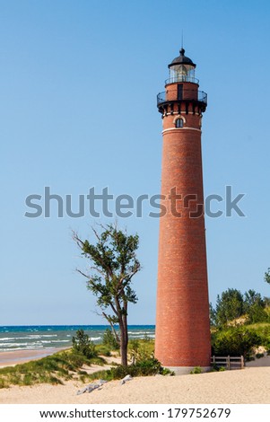The Little Sable Point Lighthouse stands on a sandy beach of Michigan\'s Lake Michigan coast in Silver Lake State Park.