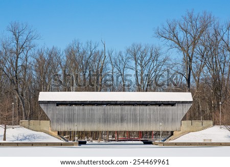 The New Brownsville Covered Bridge, seen here blanketed in winter snow, was built in 1840, was relocated to Columbus, Indiana in 1986.
