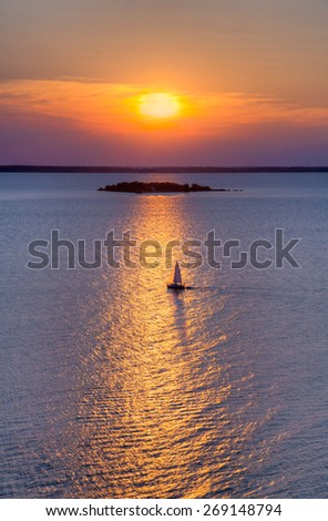 A sailboat plies the waters of Green Bay as photographed atop Sven\'s Bluff in Peninsula State Park in Wisconsin\'s famed Door County.