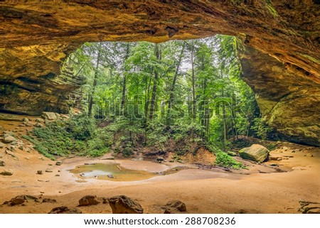 Ash Cave, a recess cave eroded from Blackhand sandstone in Ohio\'s Hocking Hills State Park, is about ninety feet high and seven hundred feet wide.