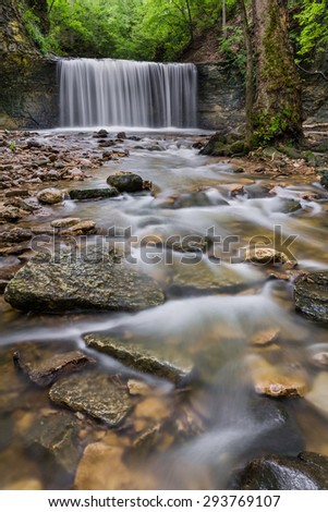 The lower waterfall at Indian Run Falls flows in a secluded area in the middle of an urban setting near Columbus, Ohio.