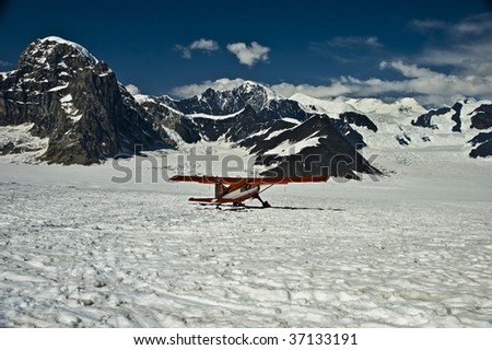 Ski plane on mountain in Alaska.