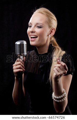 An Elegant Female Singer With Microphone Stock Photo 66574726 ...