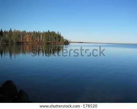Here\'s is a shot of Clear Lake in the morning from the pier.  Crystal clear and glass calm.