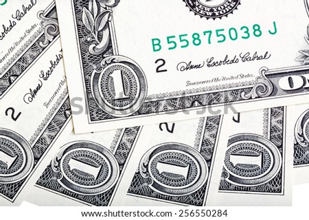A background with american one dollar bills. Close-up photo.