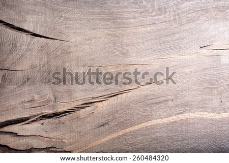 Old wood (bog oak) board weathered with scratch texture vintage background.
