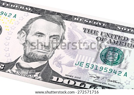 Close-up portrait of Abraham Lincoln end print of department of the treasury on five-dollar bill.