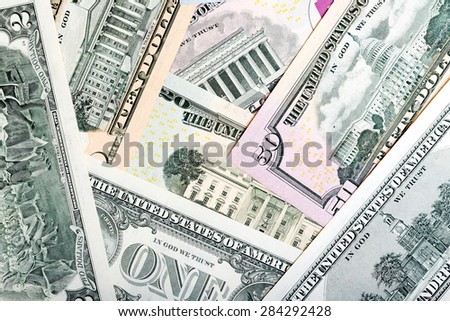 Heap of U.S. dollars, money background.