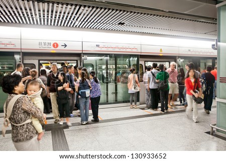 HONG KONG - APRIL 10: People waiting train  MTR underground in the Hong Kong on April 10 2011. Mass Transit Railway is rapid system in Hong Kong that is a common mode of public transport.