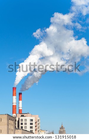 Industrial smoke stack of coal power plant in city