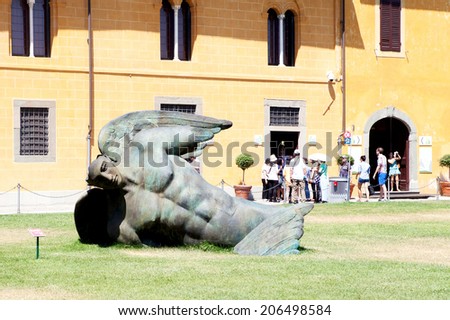 PISA, ITALY, JUNE 11: Igor Mitoraj\'s sculptures on Square of Miracles in Pisa, Italy on June 11, 2014. Igor Mitoraj is a Polish artist that make sculptures in post-modern style.