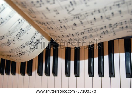Music notes and piano keyboard in black and white