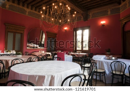 Dining room in the hall of an ancient castle.